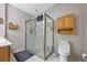 Bathroom featuring a glass shower stall and white toilet at 14566 Quail Trail Cir, Orlando, FL 32837