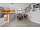 Inviting dining area features wood floors, natural light, and a charming gallery wall for a cozy and stylish space at 14566 Quail Trail Cir, Orlando, FL 32837