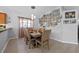 This dining room offers a comfortable space with wood floors, a decorative gallery wall and natural light at 14566 Quail Trail Cir, Orlando, FL 32837