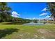 Backyard overlooking a tranquil lake, a scenic and private retreat at 14566 Quail Trail Cir, Orlando, FL 32837