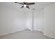 Bedroom featuring light wood flooring, a ceiling fan, and white doors, providing a blank canvas for personalization at 1565 Diamond Loop Dr, Kissimmee, FL 34744
