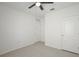 Bedroom featuring light flooring, a ceiling fan, and multiple white doors, offering a blank canvas for personalization at 1565 Diamond Loop Dr, Kissimmee, FL 34744