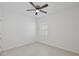 Well-lit bedroom with wood look flooring, a ceiling fan, and a bright window that offers nice outdoor views at 1565 Diamond Loop Dr, Kissimmee, FL 34744