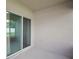 A cozy patio with sliding glass doors offering easy access to indoor living spaces and outdoor relaxation at 1565 Diamond Loop Dr, Kissimmee, FL 34744