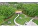 Aerial view of a park picnic area, complete with picnic tables, benches, and scenic landscaping at 1565 Diamond Loop Dr, Kissimmee, FL 34744