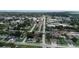 An aerial view of neighborhood and community buildings along a street at 1612 Eastern Ave, St Cloud, FL 34771