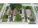 An aerial view of homes with driveways, cars and mature trees at 1612 Eastern Ave, St Cloud, FL 34771