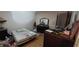 Bedroom containing furniture and an unmade bed at 1612 Eastern Ave, St Cloud, FL 34771