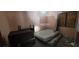 Bedroom with a bed and furniture at 1612 Eastern Ave, St Cloud, FL 34771