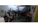 Garage space with lots of clutter and stored items at 1612 Eastern Ave, St Cloud, FL 34771