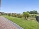 Well-maintained backyard with lush lawn, manicured landscaping and golf course views at 1709 Benoit Ter, Davenport, FL 33837