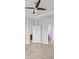 Hallway with views of a purple bedroom and a kitchen area at 1709 Benoit Ter, Davenport, FL 33837