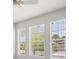 Bright window features white blinds with views of neighborhood vegetation at 1709 Benoit Ter, Davenport, FL 33837