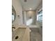 Clean, modern bathroom features a tub-shower combo and updated vanity with quartz countertop at 1732 Sw 6Th St, Ocala, FL 34471