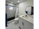 Modern bathroom featuring a walk-in shower with sleek fixtures, a contemporary vanity, and elegant marble flooring at 1732 Sw 6Th St, Ocala, FL 34471