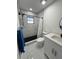 Modern bathroom featuring a walk-in shower with sleek fixtures, a contemporary vanity, and elegant marble flooring at 1732 Sw 6Th St, Ocala, FL 34471