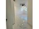 A look inside the bedroom with beautiful marble floors and a modern ceiling fan at 1732 Sw 6Th St, Ocala, FL 34471