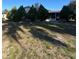 View of the front exterior showcasing mature landscaping and a well-maintained lawn at 1732 Sw 6Th St, Ocala, FL 34471
