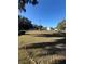 Open front yard with a few mature trees and a clear view of the neighborhood at 1732 Sw 6Th St, Ocala, FL 34471