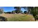 Expansive front yard with mature trees and plenty of room to add landscaping features at 1732 Sw 6Th St, Ocala, FL 34471