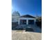 House with two car garage featuring open doors and refinished painted floor at 1732 Sw 6Th St, Ocala, FL 34471