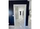 Hallway featuring marble floors, doors and contrasting accent walls at 1732 Sw 6Th St, Ocala, FL 34471