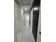 Hallway features marble floors, neutral paint and contrasting accent wall at 1732 Sw 6Th St, Ocala, FL 34471