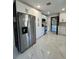 Bright, renovated kitchen boasts stainless steel appliances and white cabinetry at 1732 Sw 6Th St, Ocala, FL 34471