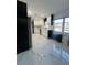 Bright kitchen with marble floors, stainless appliances, and plenty of counter space at 1732 Sw 6Th St, Ocala, FL 34471