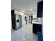 Modern kitchen features stainless steel appliances, white cabinets, and subway tile backsplash at 1732 Sw 6Th St, Ocala, FL 34471
