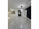 Spacious living room with modern light fixtures and marble floors at 1732 Sw 6Th St, Ocala, FL 34471