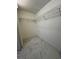 Walk-in closet with shelving and new tile floor at 1732 Sw 6Th St, Ocala, FL 34471