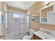 Standard bathroom with a shower and tub, a single sink vanity, toilet, and tiled shower walls at 1803 Tillstream Dr, Orlando, FL 32818