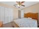 Bedroom with ceiling fan, closet, and light-colored walls at 1803 Tillstream Dr, Orlando, FL 32818