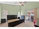 Bedroom featuring a vaulted ceiling with a ceiling fan and sliding glass door to the outside at 1803 Tillstream Dr, Orlando, FL 32818