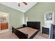 Bedroom with vaulted ceiling, two windows, and an ensuite bathroom at 1803 Tillstream Dr, Orlando, FL 32818