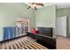 Bedroom with vaulted ceiling, sliding glass door, and a dresser at 1803 Tillstream Dr, Orlando, FL 32818
