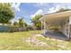Spacious backyard and covered patio is perfect for relaxing and entertaining guests at 1824 Dorris Dr, Orlando, FL 32807