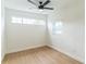 This light and airy bedroom features hardwood floors, a ceiling fan, and bright, natural light at 1824 Dorris Dr, Orlando, FL 32807