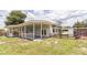 This home's covered patio and backyard is perfect for outdoor living and entertaining at 1824 Dorris Dr, Orlando, FL 32807