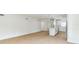 Bright living room with an open floor plan, wood-look floors, and an island kitchen with white cabinets at 1824 Dorris Dr, Orlando, FL 32807