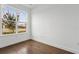 Bright bedroom featuring hardwood floors, a large window, and neutral walls at 2018 Packing District Way, Orlando, FL 32804