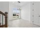 Open-concept dining area with modern chandelier, large window, and neutral tile flooring at 2018 Packing District Way, Orlando, FL 32804