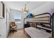 Bright bedroom with a bunk bed, desk, chair, and plenty of natural light at 2076 Shannon Lakes Blvd, Kissimmee, FL 34743