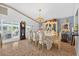 Elegant dining room with ornate chandelier, vintage hutch and outdoor views at 2076 Shannon Lakes Blvd, Kissimmee, FL 34743