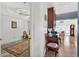 Hallway featuring a view into the living room with the formal dining room visible at 2076 Shannon Lakes Blvd, Kissimmee, FL 34743