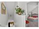 Hallway with a decorative flower arrangement leading into the bedroom at 2076 Shannon Lakes Blvd, Kissimmee, FL 34743