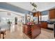 Spacious kitchen with center island, tiled floors, and adjacent dining area with large windows at 2076 Shannon Lakes Blvd, Kissimmee, FL 34743