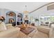 Well-appointed living room featuring vaulted ceilings, fireplace, and cozy seating at 2076 Shannon Lakes Blvd, Kissimmee, FL 34743