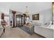 Living room with carpet, chandelier, columns and a view of the dining room at 2076 Shannon Lakes Blvd, Kissimmee, FL 34743